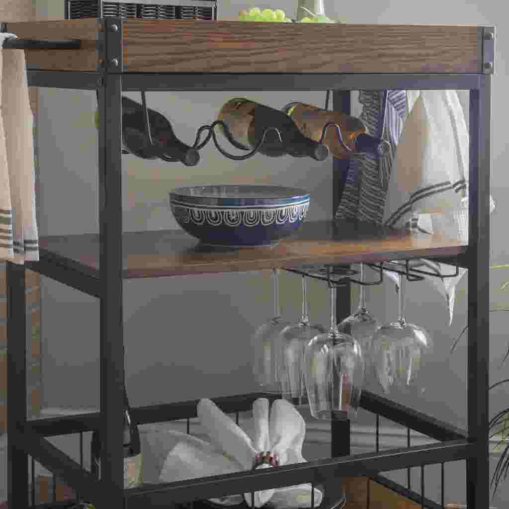 Close-up of the middle shelf of the Austin Kitchen Cart, holding a bowl and wine glasses.