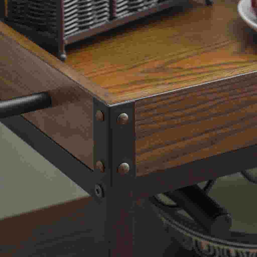 Close-up of the corner of the Austin Kitchen Cart, showing the wooden top and metal frame.