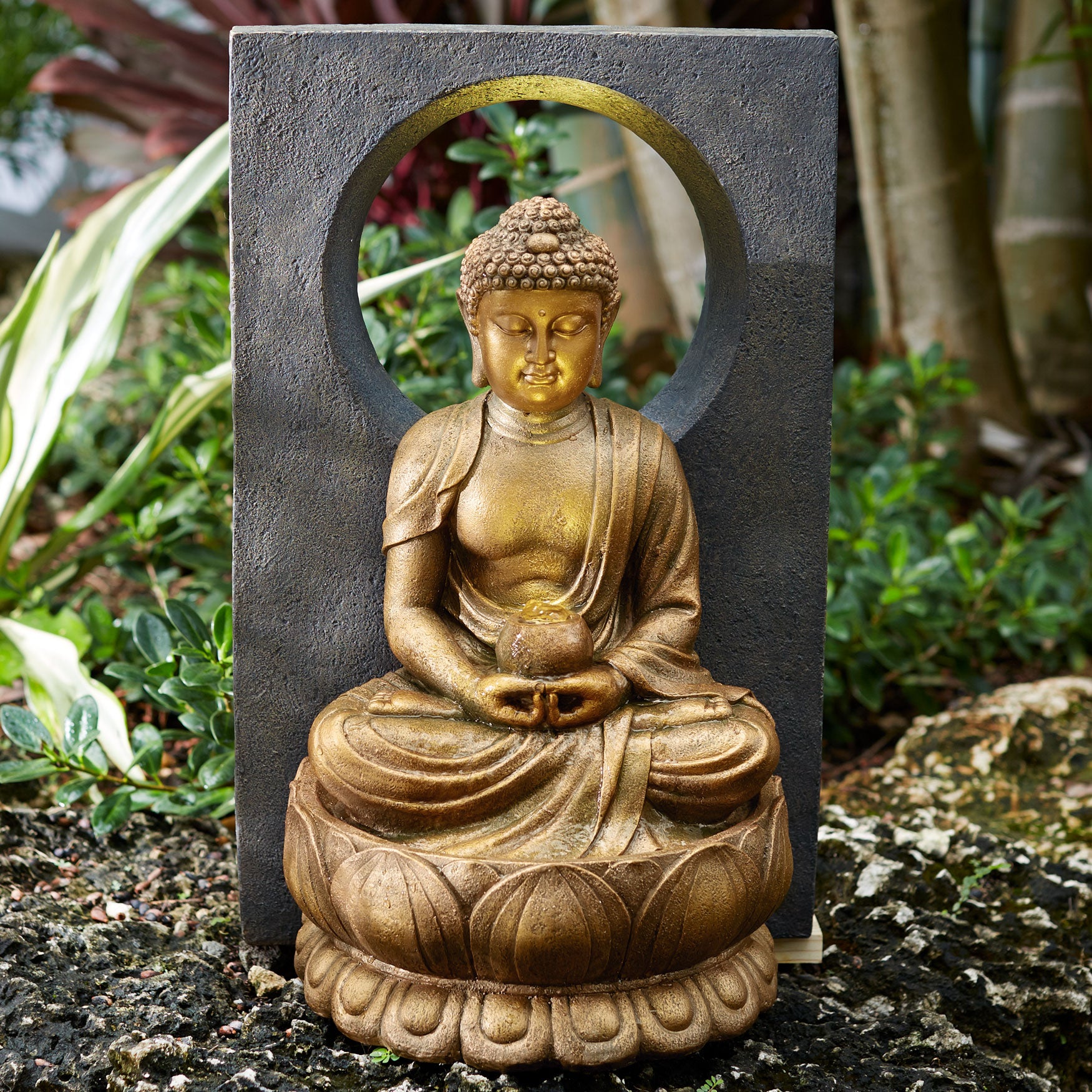 resin meditating buddha on column patio fountain with led light